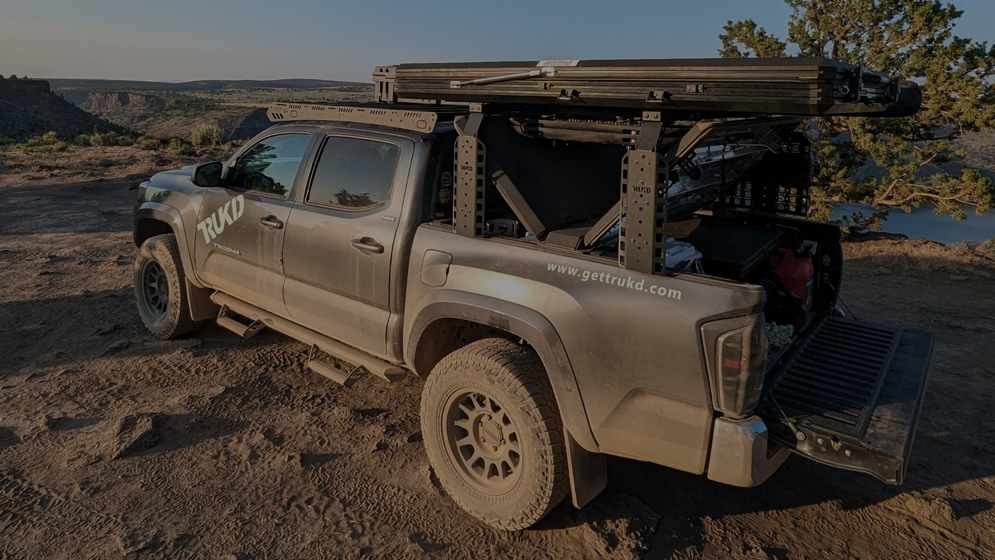 Tacoma with overland bed rack and diamondback cover